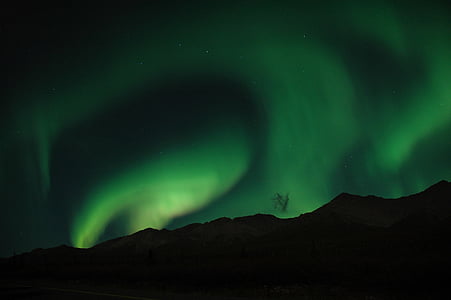 silhouette of mountain under aurora borealis thumbnail
