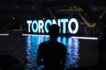 man standing near body of water thumbnail