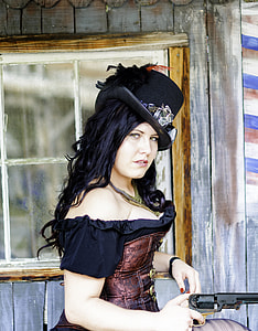woman in black cowboy hat holding revolver gun thumbnail