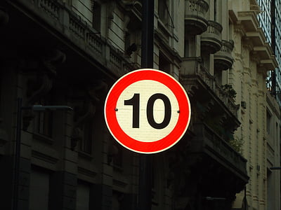 red and white 10 signage near building thumbnail