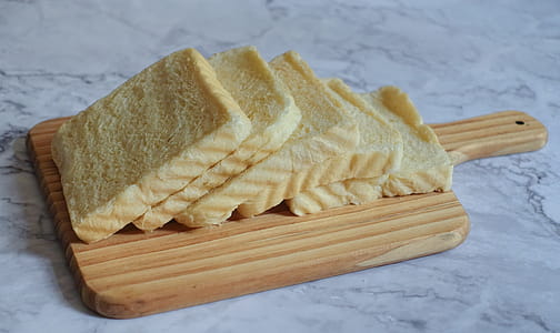 Photography of Sliced Bread on Chopping Board thumbnail