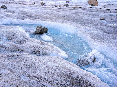 rock formations on body of water thumbnail