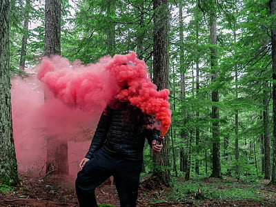 man blowing red smoke thumbnail