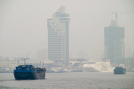 black and blue ship on body of water thumbnail
