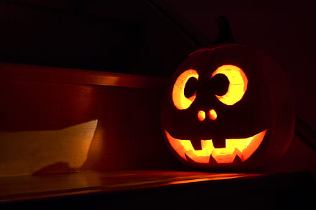 Jack-O-Lantern lamp on wooden surface thumbnail