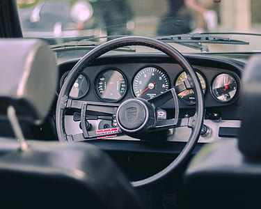black Porsche steering wheel thumbnail