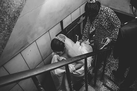 Grayscale Photography of Bride on Stair thumbnail