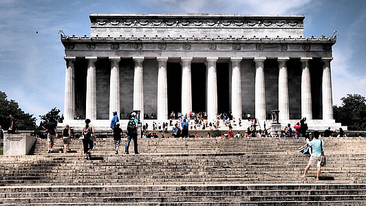 people walking on stairs near concrete building during daytime thumbnail