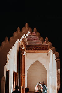 way through four persons standing inside white painted room thumbnail