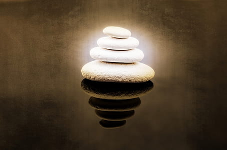 stack of four white stones thumbnail