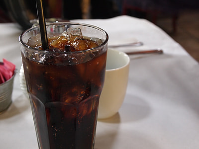 clear glass filled with black liquid thumbnail
