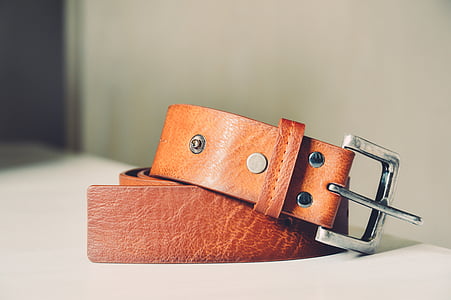 brown leather belt on white surface thumbnail