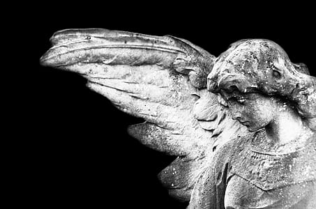 angel statue looking downward thumbnail