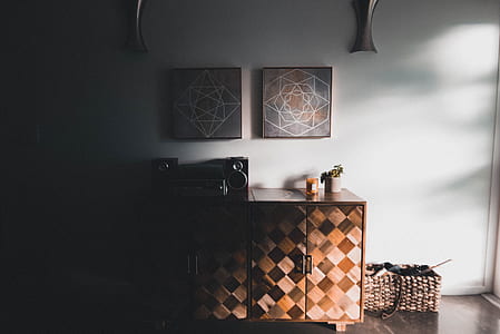 Black Audio Speaker on Brown Wooden Cabinet thumbnail