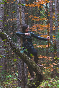 woman holding composite bow on forest thumbnail