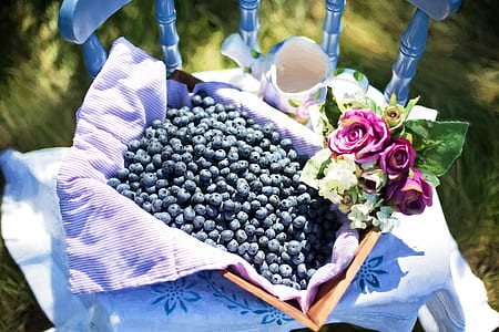 shallow focus photography of blueberries in brown box thumbnail