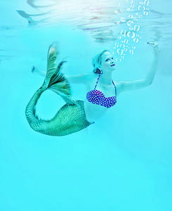 edited photo of mermaid woman swimming underwater thumbnail