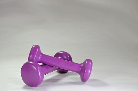 pair of purple dumbbells on white surface thumbnail