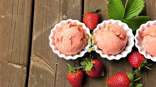 three strawberry ice cream and fruit on wooden surface thumbnail