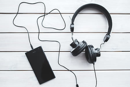Black headphones with mobile smartphone thumbnail