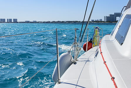 white motorboat on body of water at daytime thumbnail