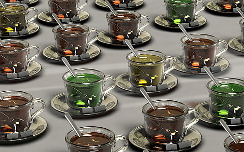 clear glass teacup with assorted-color liquid inside lot thumbnail