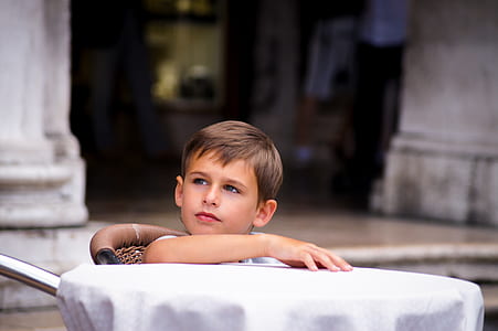 toddler sitting in front of table thumbnail