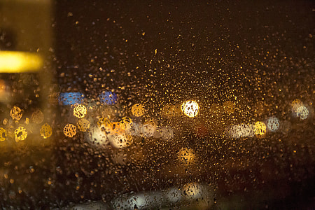 water droplets on window glasses in focus lens photography thumbnail