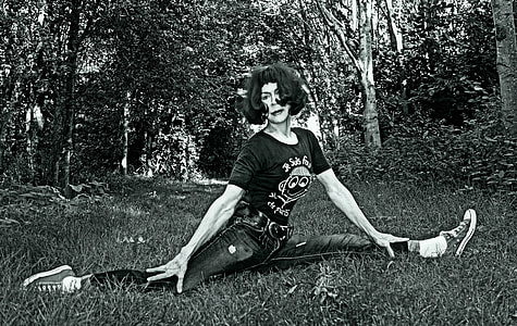 woman wearing crew-neck shirt and performing stunt photo thumbnail