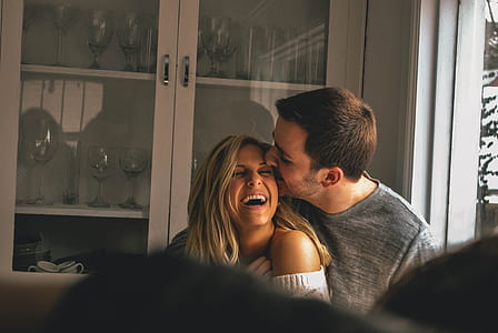man kissed woman's face in front of display cabinet thumbnail