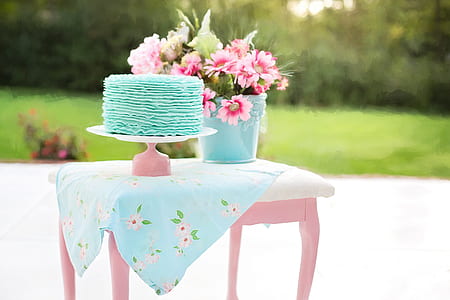 teal fondant cake on pink cake tray thumbnail