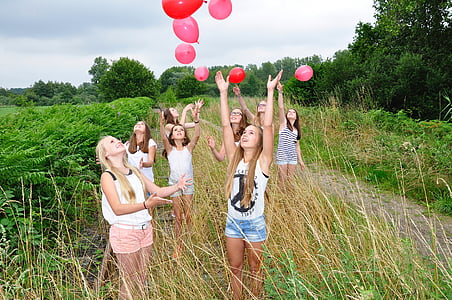 photo of girls flying balloons thumbnail