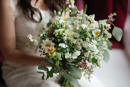 woman holding white flowers thumbnail