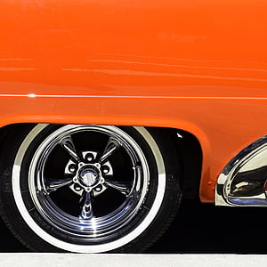 classic orange vehicle with chrome 5-spoke vehicle wheel and white wall tire thumbnail