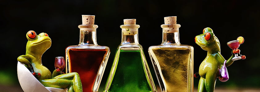 three cork bottles between two frogs thumbnail
