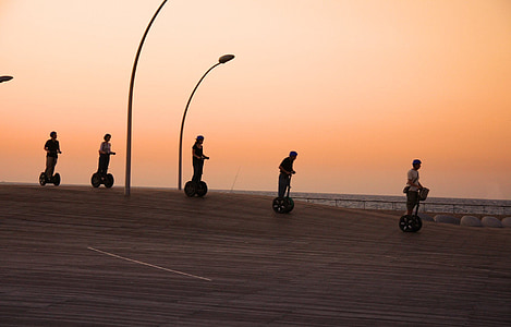 five people riding personal transport machine thumbnail