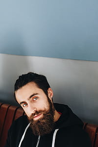 Man Wearing Black Zip-up Hooded Jacket Facing Camera thumbnail