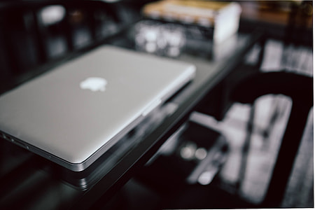 Organized desk with laptop and journals thumbnail