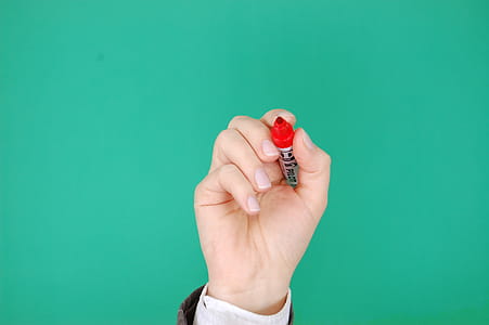 Person Holding Red Marker thumbnail