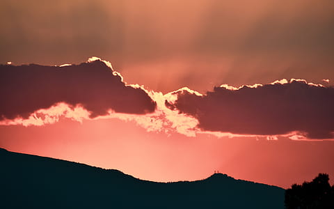 sunlight across two gray clouds during sunset thumbnail