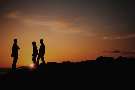 silhouette photography of three person thumbnail