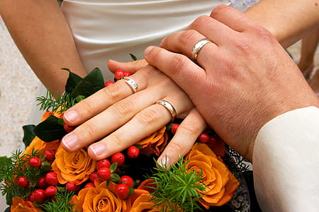 man holding woman wearing wedding bands thumbnail