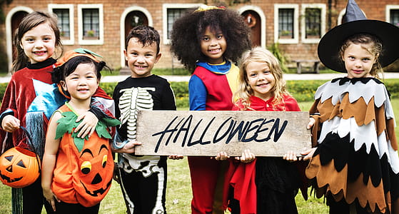 Photo of children in Halloween Costumes Smiling thumbnail