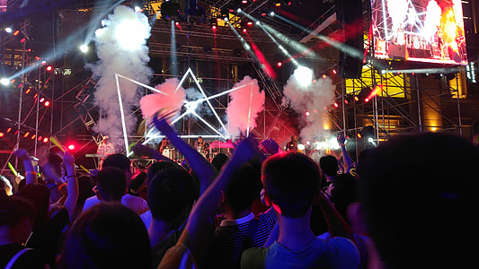 group of people dancing near stage thumbnail