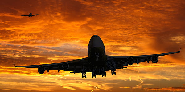 airplane flying on air at sunset thumbnail