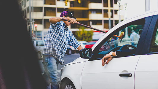man cleaning white vehicle's windscreen thumbnail