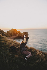 person taking picture of nature thumbnail