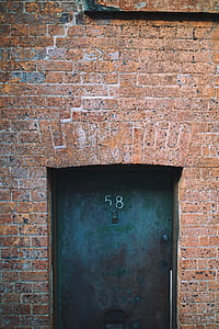 green steel door during daytime thumbnail