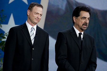 two men wearing black suit jackets thumbnail