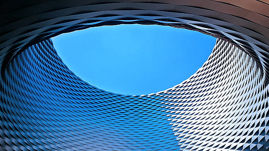 worm's-eye view photography of round concrete building thumbnail